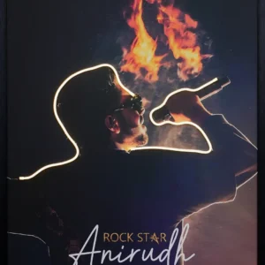 Anirudh Ravichander LED wall decor featuring glowing neon silhouette, microphone performance, and dramatic fire concert background